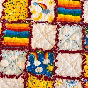 Handmade rainbow crib quilt